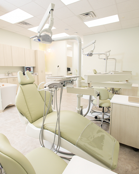 Woman smiling while listening to her orthodontist