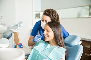 Patient with braces smiling with orthodontist