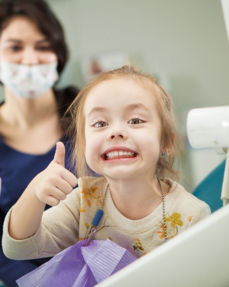 Child smiling at the dentist