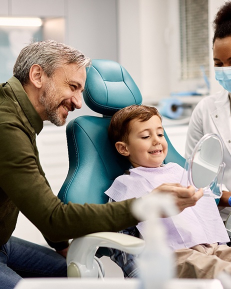 Child smiling in the dental chair
