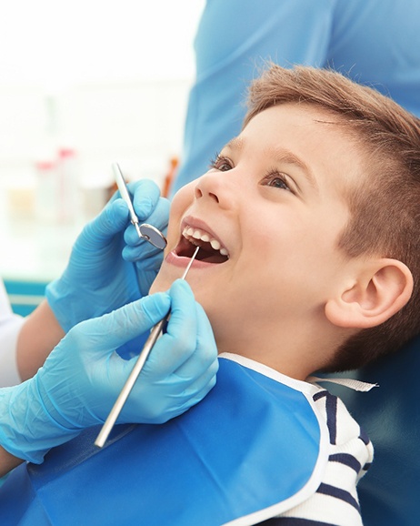 Child smiling at the dentist