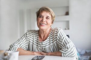 Older woman with braces smiling